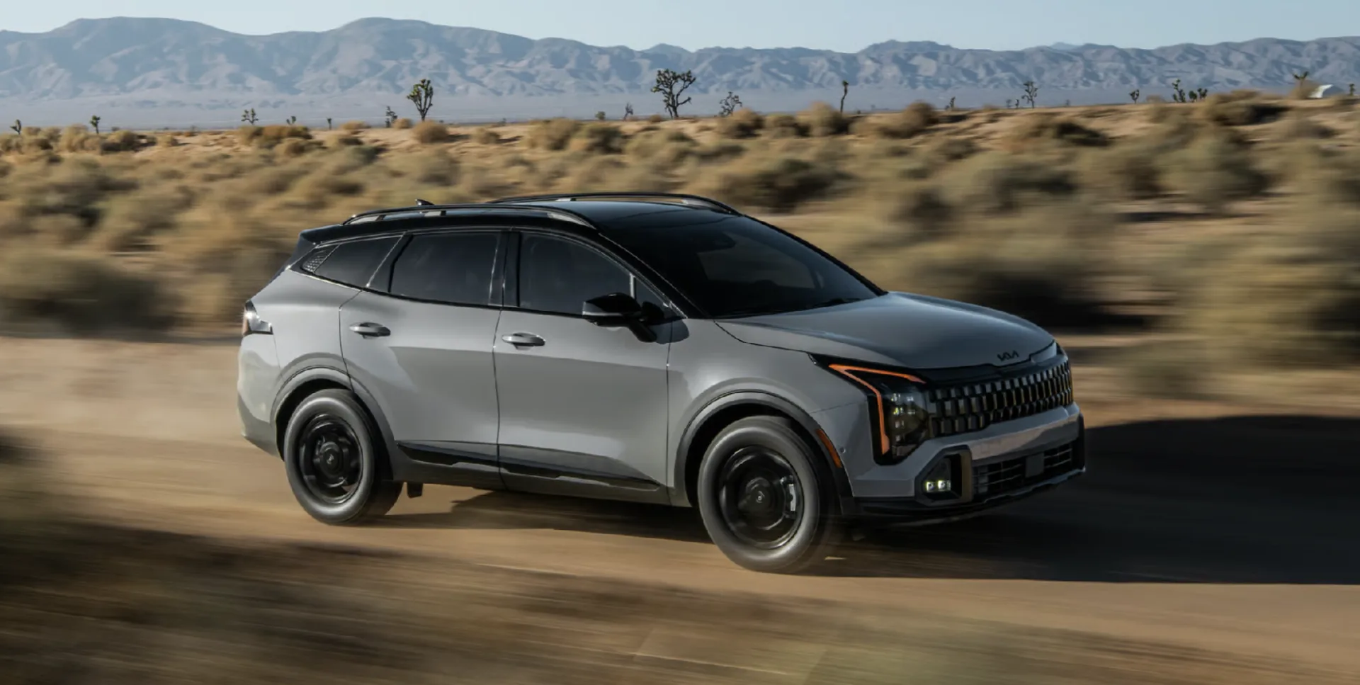 The 2026 Kia Sportage available with 17-in. wheels, all-terrain tires, and vertical LED headlights helps you take on new roads