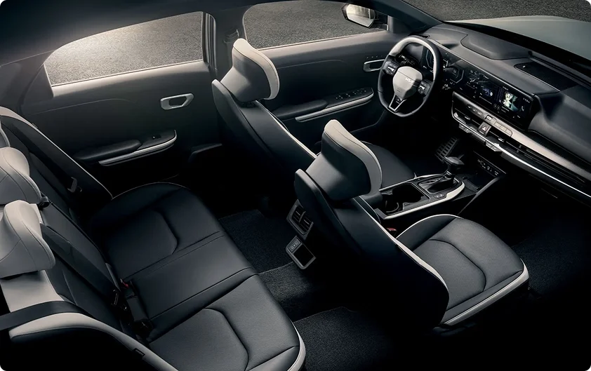 Overhead view of the 2026 Kia K4 black interior showing the front seats, rear bench and dashboard