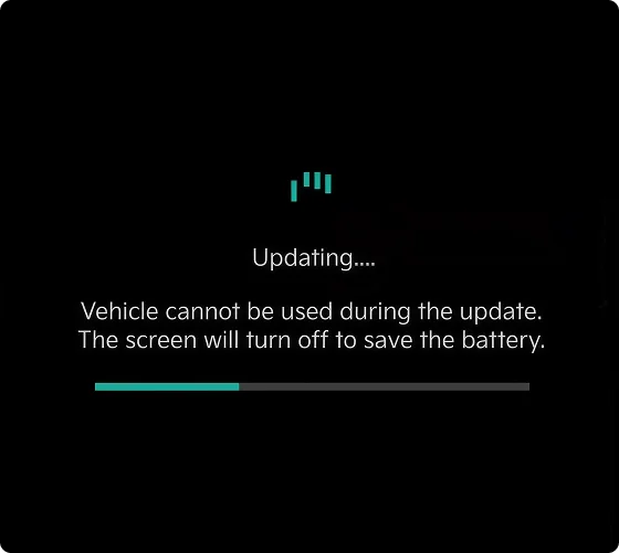 Kia vehicle touchscreen displaying an Updating message with a progress bar during an over-the-air software update