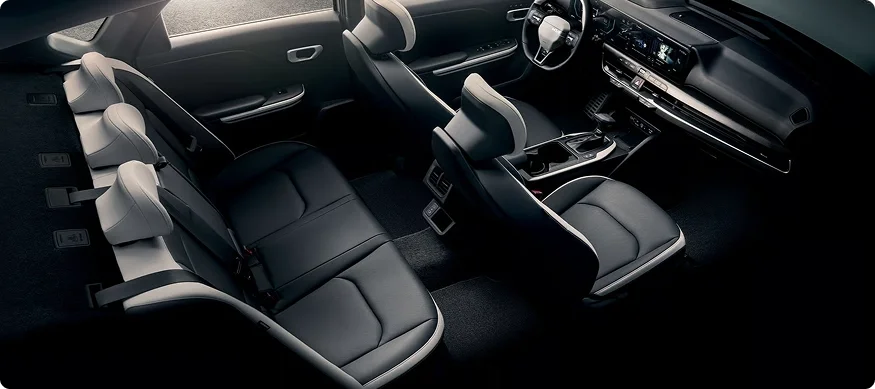 Overhead view of the 2026 Kia K4 cabin showing the front seats, rear bench and dashboard