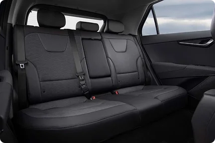 2026 Kia Niro Hybrid rear bench seat in black cloth upholstery with the rear side windows behind it