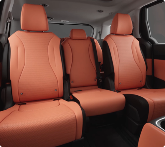 Carnival MPV second and third-row seating in orange leather with the middle Slide-Flex seat in place