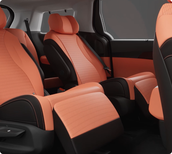Carnival MPV second-row captain's chairs upholstered in orange leather