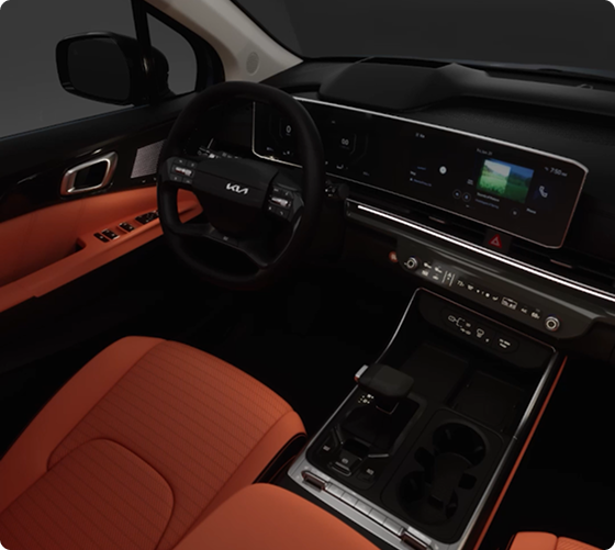 Carnival MPV dashboard and front seats lit by color-selectable ambient lighting