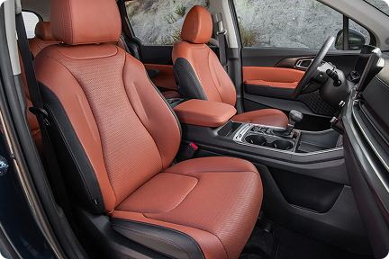 Carnival MPV front seats and center console in orange leather
