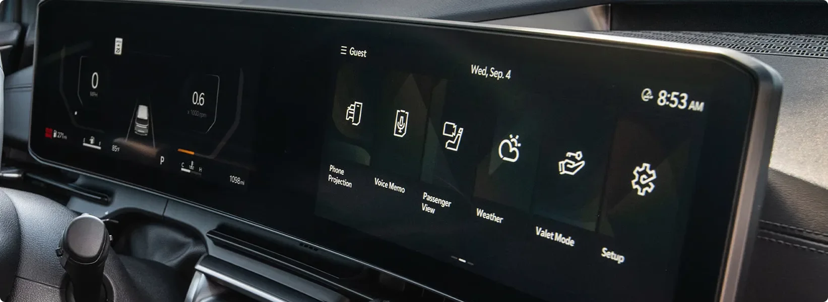Carnival MPV panoramic display showing the home menu of vehicle feature icons