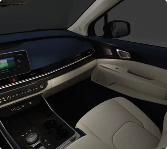 Carnival MPV Hybrid dashboard and front seats lit by color-selectable ambient lighting