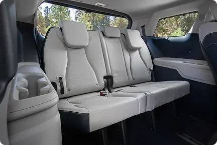 Carnival MPV Hybrid second and third-row seats in cream leather