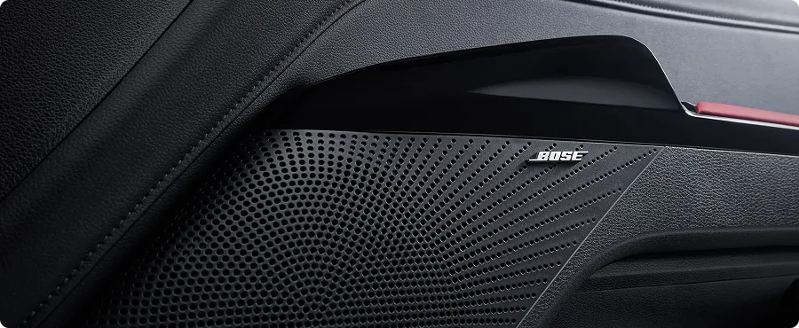 Bose Premium Audio speaker grille in the Kia K5 door trim