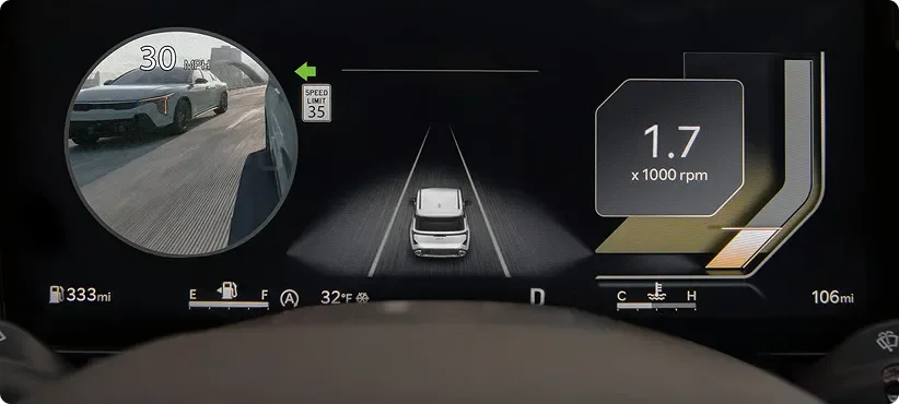 Seltos gauge cluster showing a round live camera feed of the rear blind spot