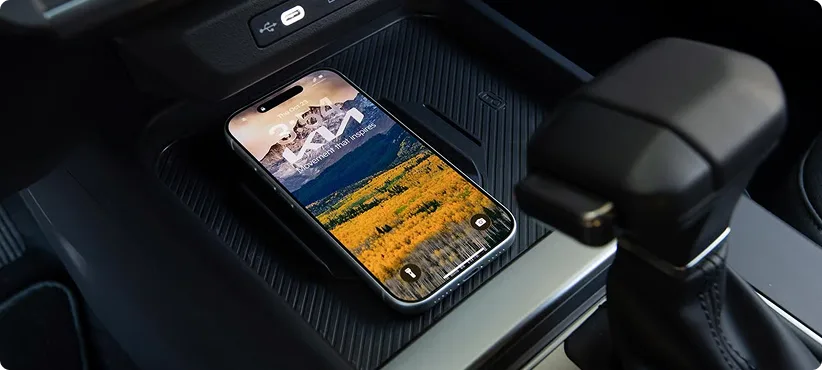 Smartphone charging on the wireless pad in the Seltos centre console