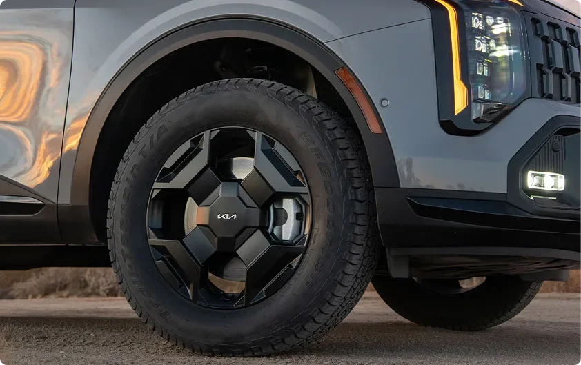 Close-up of a Sportage X-Pro wheel with all-terrain tires