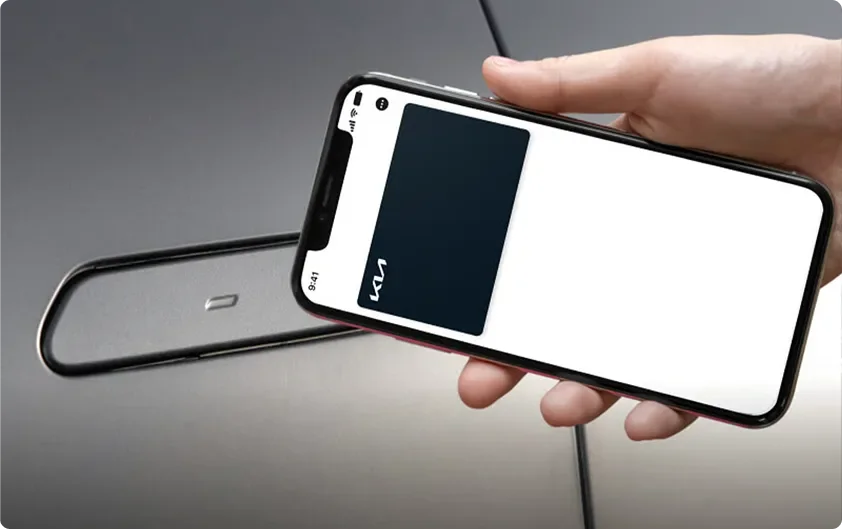 Hand holding a smartphone acting as a Digital Key 2.0