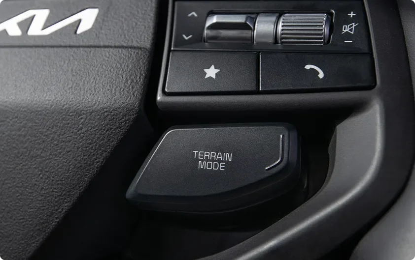 Close-up of the Sportage Multi-Terrain Mode selector dial