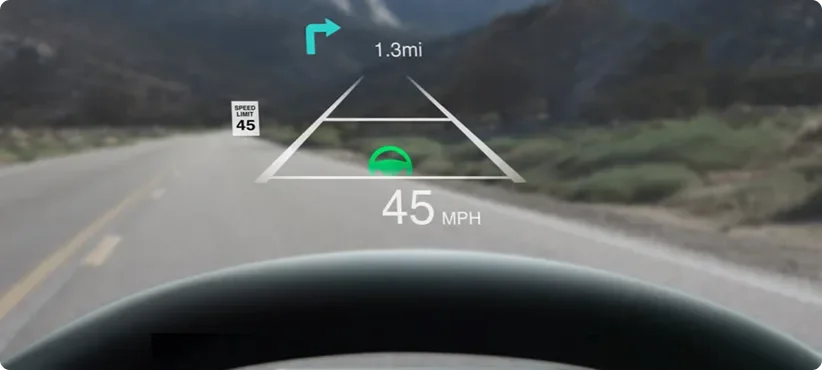 Head-Up Display projected on the windshield showing 45 MPH, a turn arrow at 1.3 mi and a 45 speed limit sign