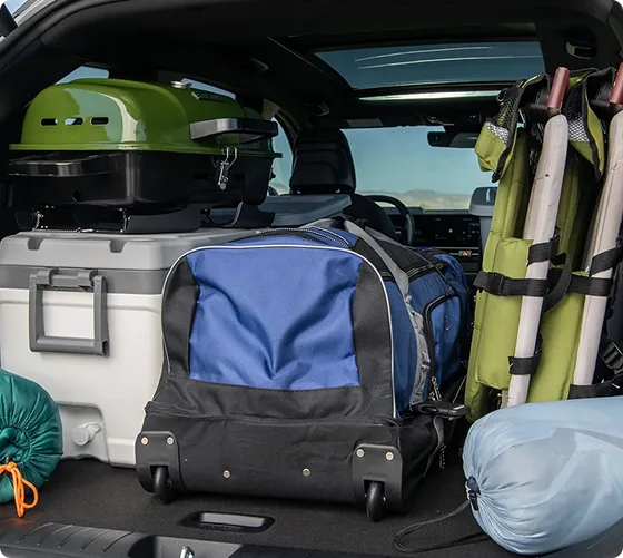 Sportage Plug-in Hybrid cargo area loaded with camping and outdoor gear