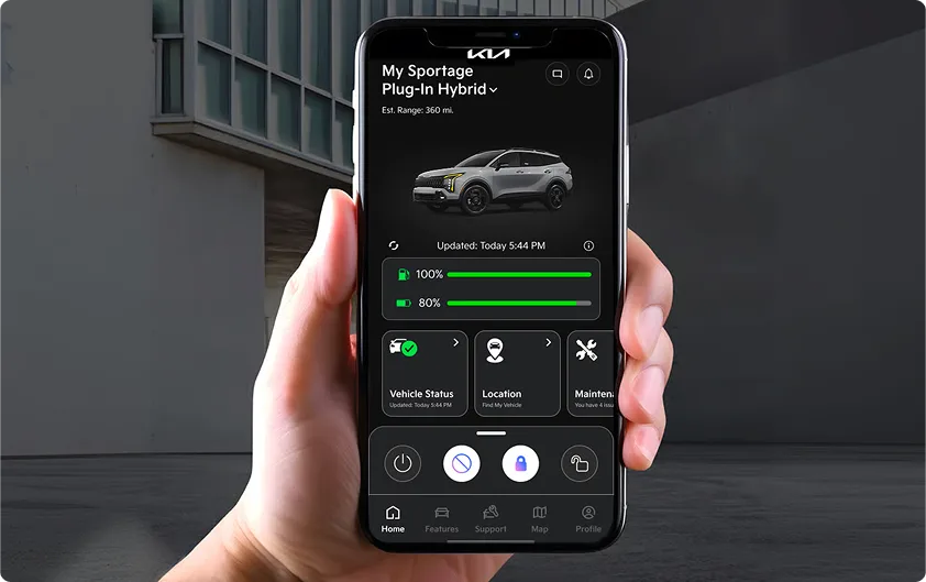 Hand holding a smartphone showing the Kia Connect app with a Sportage Plug-in Hybrid on screen