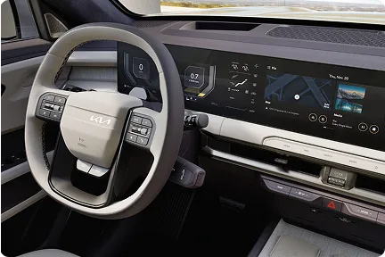 Telluride Hybrid steering wheel and curved dual display seen from the driver's seat