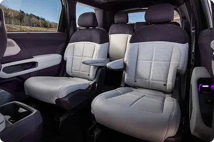 Telluride Hybrid second-row captain's chairs in light leather with a fold-out table