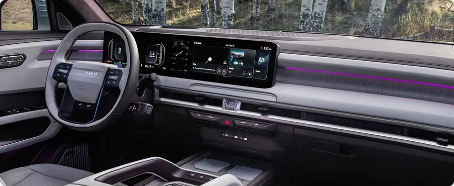 Telluride Hybrid front cabin in light grey leather with woodland through the windshield