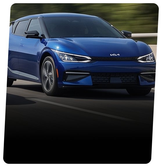 Blue Kia EV6 electric crossover driving on a highway
