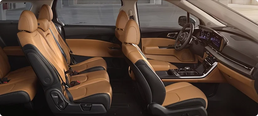 Cutaway side view of a Kia cabin with tan and black leather seats in all three rows