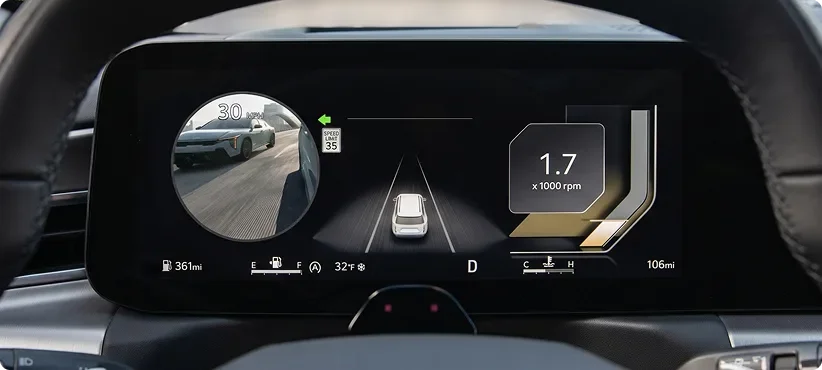 Telluride gauge cluster showing a round live camera feed of the rear blind spot