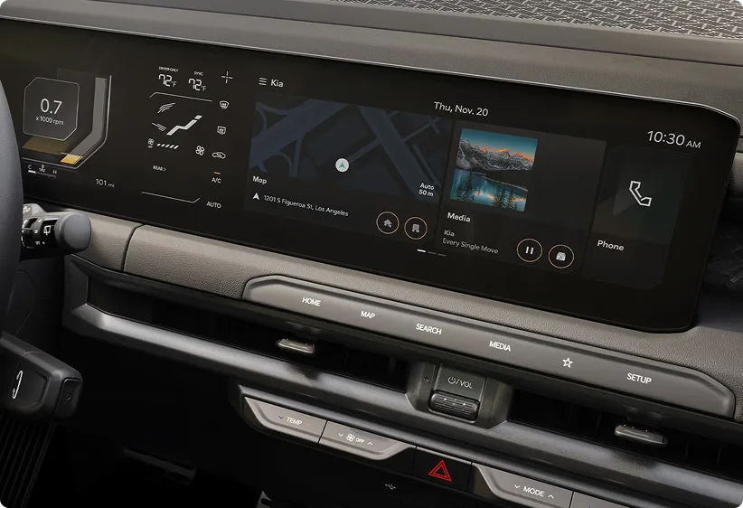 Close-up of the Telluride curved dual display running navigation and media