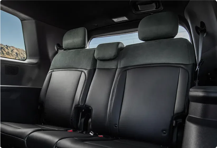Telluride third-row seats in dark leather with a window view