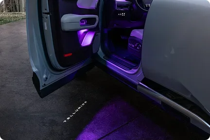 Open Telluride door projecting purple ground lighting with the Telluride name