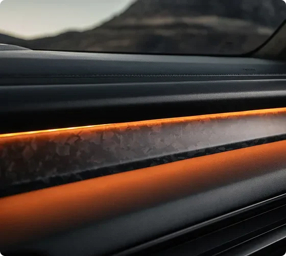 Close-up of an orange ambient light strip running along the Telluride dashboard trim