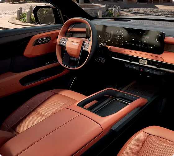Telluride interior in tan leather with the steering wheel and dual displays