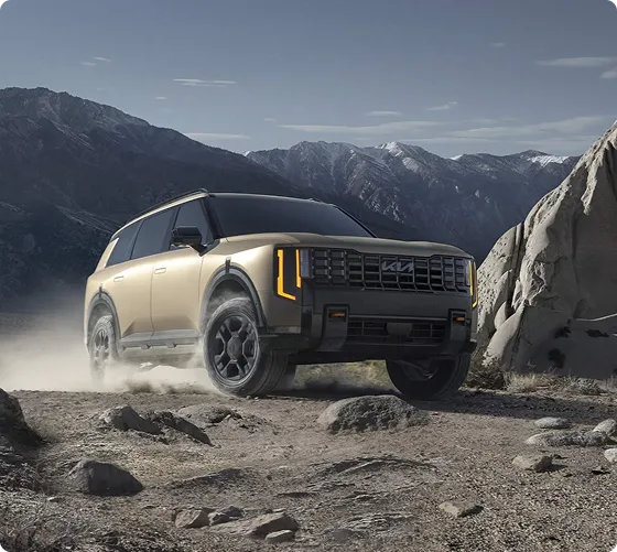 Bronze Telluride kicking up dust on rocky desert terrain